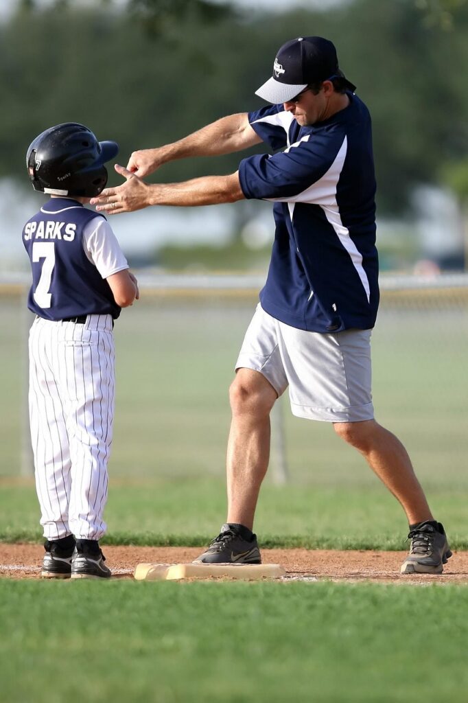 7 Myths Standing Between Men and Their Best Self: Men’s Health Month 7 a baseball coach demonstrates to a little league player how to swing. Myth number 7. In life we need help from others who can see what we don't see.